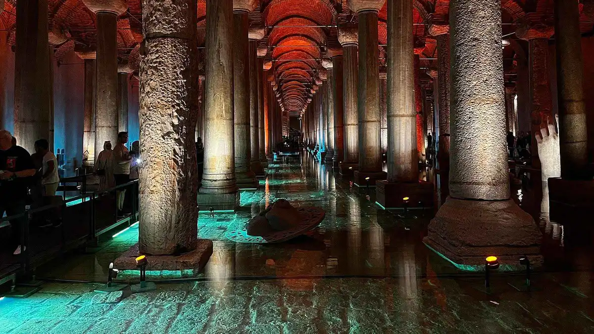Lit columns reflected in the water of the Basilica Cistern in Istanbul, Türkiye